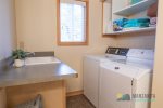 The downstairs bathroom has a washer and dryer with detergent included. There are also beach towels there.